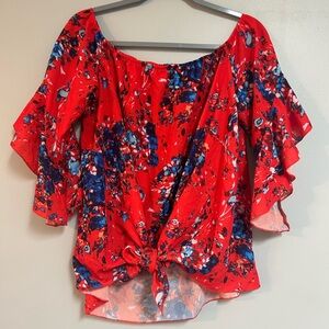 Red and blue splatter patterned off shoulder blouse